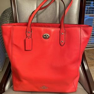 Salmon colored Coach tote bag